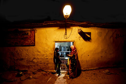 Buying bread on Ramadan night - a Photographic Art Artowrk by Josep Sanmartín