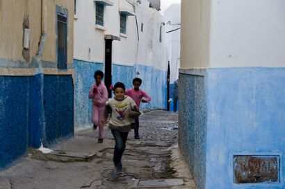 Children run in the street - A Photographic Art Artwork by Andrea Mattia
