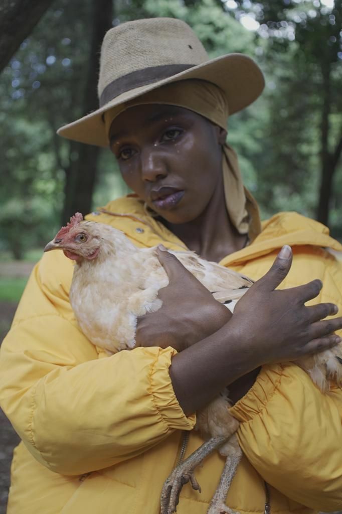 Bakhita with Chicken - a Photographic Art by Nyokabi kimari