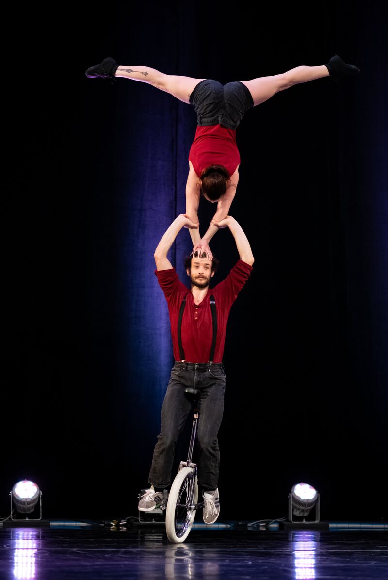 Hand to Hand on Unicycle - a Performance by Babou