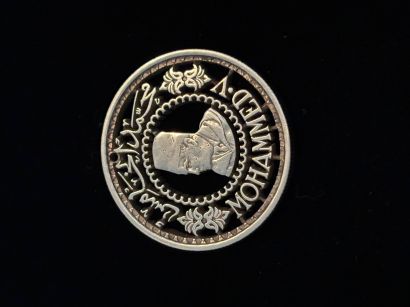 Hand Cut 1956 Morrocan 500 Franc Coin w Mohammed V - a Sculpture & Installation Artwork by Robert Johnson 